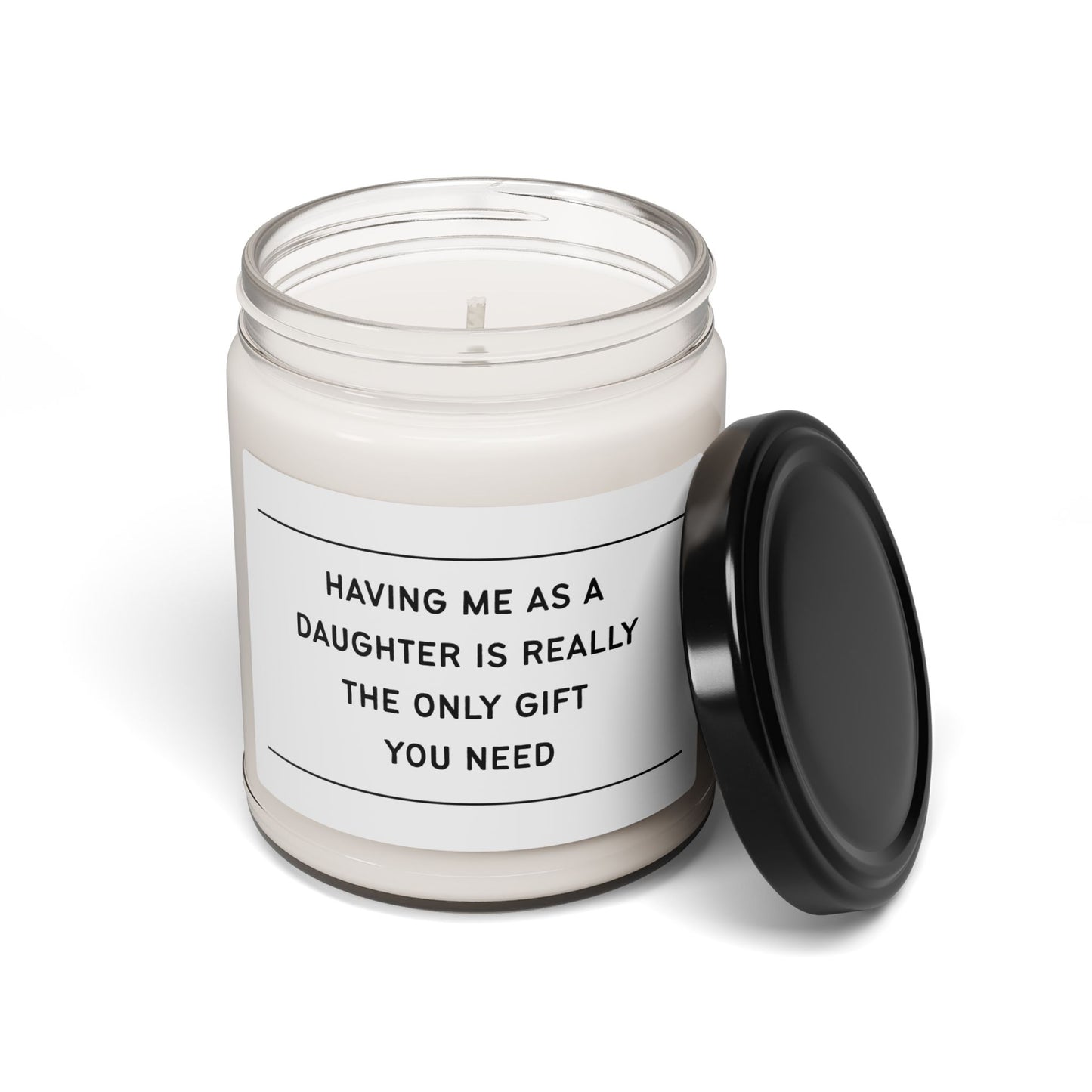 Candle in a clear jar with a black lid, featuring a white label with text on a white background.